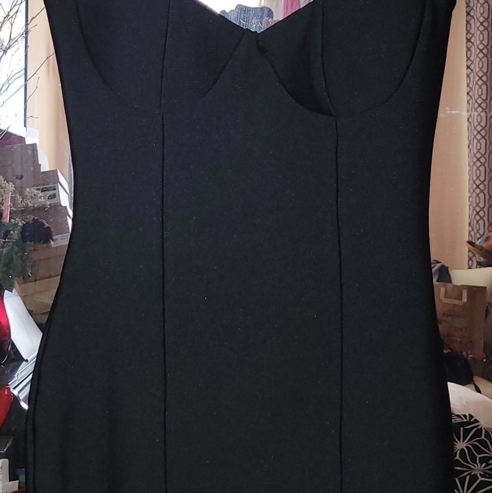 Black Fitted dress with gold shingle detail on back of dress and bottom.